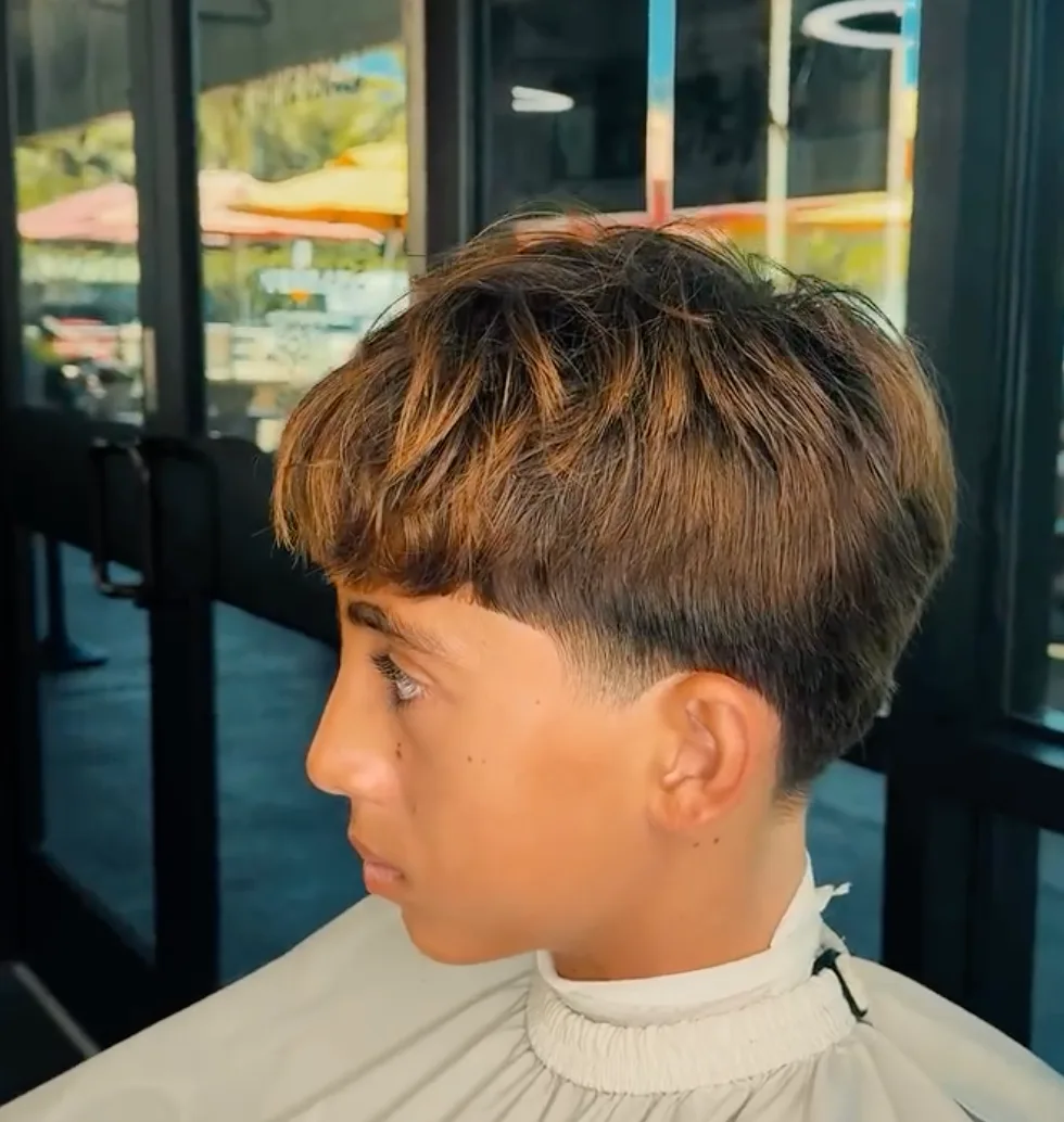 Long hair to clean textured cut transformation at The HI Fade Barbershop — after